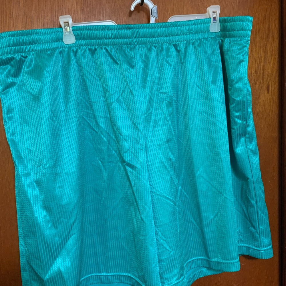 Men’s starter brand shorts. Size 2X. Teal aqua color.
